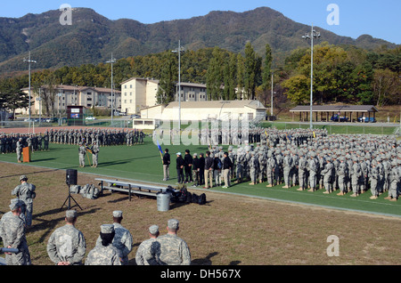 Manchu soldiers from 2nd Battalion, 9th Infantry Regiment, 1st Armored Brigade Combat Team, 2nd Infantry Division, gather in Soldiers' Field at Camp Casey during the opening ceremony of the Manchu Mile with special guests from KATUSA Veterans Associations Stock Photo