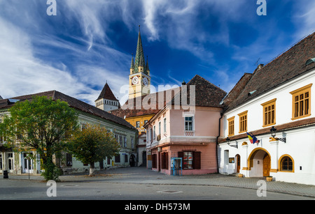 Medias, Transylvania. Cityscape of downtown in medieval city with fortified church tower, landmark in Romania. Stock Photo