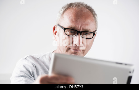 Businessman working on a tablet PC, Mannheim, Baden-Württemberg, Germany Stock Photo