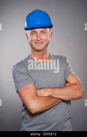 Construction worker wearing a hard hat, Mannheim, Baden-Württemberg, Germany Stock Photo