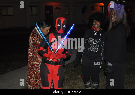 Soldiers from 70th Brigade Support Battalion, 210th Fires Brigade, 2nd Infantry Division, show off their Halloween costumes before beginning a battalion Halloween fun run. This run focused on building unit cohesion and morale throughout the unit. Stock Photo