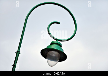 Outdoor green lighting pole shot against clear sky Stock Photo