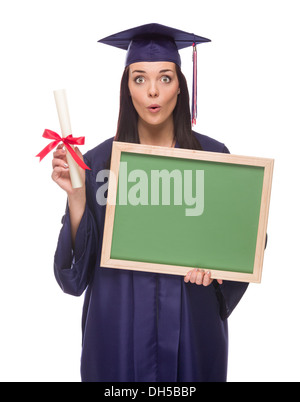 Happy Graduating Mixed Race Female Wearing Cap and Gown Holding a Blank Chalkboard and Diploma Isolated on a White Background. Stock Photo