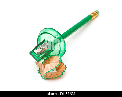 Green sharpener and pencil on white background. Stock Photo