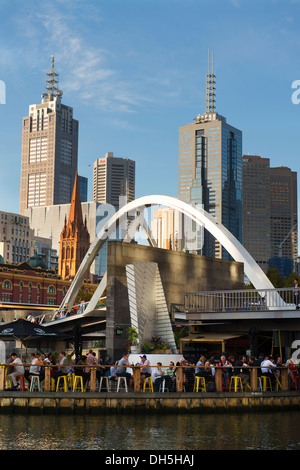 Ponyfish Island is a bar/restaurant underneath the Evan Walker pedestrian bridge over the Yarra River in the city's Southbank Precinct. Stock Photo