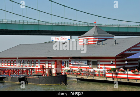 The 'Alte Liebe' boathouse, a boat restaurant on the banks of the Rhine at Cologne-Rodenkirchen, North Rhine-Westphalia Stock Photo
