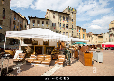 Flea market on the Piassa Grande Square in Arezzo Tuscany Italy