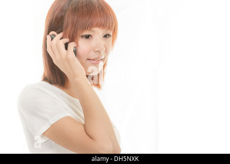 Asian female holding cordless phone Stock Photo