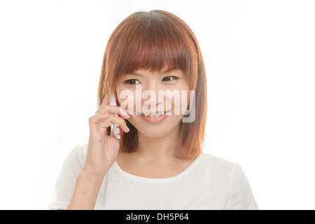 Asian female holding cordless phone Stock Photo