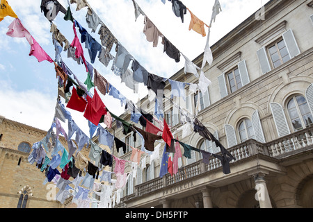 Some clothes hanging outside in the historic city of Arezzo, Tuscany, Italy Stock Photo