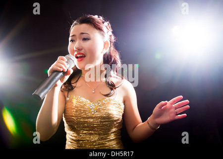 Concert young Asian singer of the girl Stock Photo