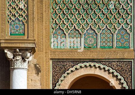 Columns with decorations and tile mosaics, zellige, zillij or zellij tilework on the Bab Mansour gate, medina, Meknes, Morocco Stock Photo