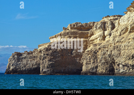 Impressive formations of sandstone rock cliffs at Matala, situated on the Bay of Messara, Crete, Greece. Stock Photo