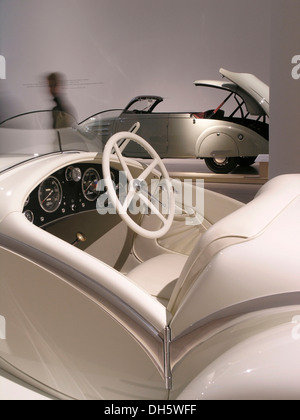 Alfa Romeo 6C Gran Sport in front of aPeugeot 402 Eclipse, Mitomacchina exhibition, Museum of Modern Art, MART, Rovereto, Italy Stock Photo