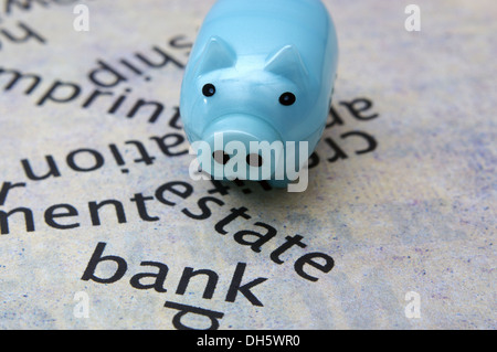 Estate text on paper with piggy bank Stock Photo