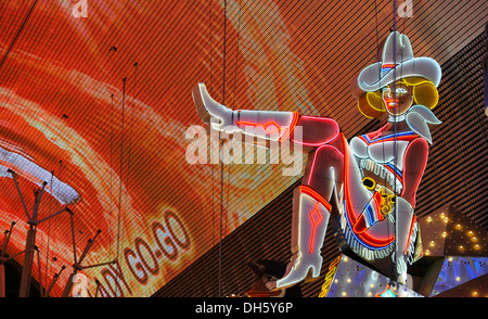 Vicky, famous cowgirl figure on a neon sign in old Las Vegas, Glitter Gulch Casino Hotel, Fremont Street Experience Stock Photo