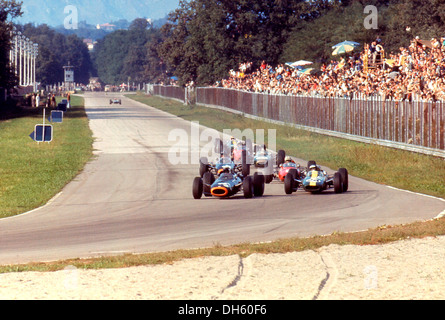 Jackie Stewart BRM P261 leads Jim Clark Lotus, Graham Hill BRM P261, Dan Gurney Brabham-Climax BT11Italian GP Monza, Italy 1965. Stock Photo