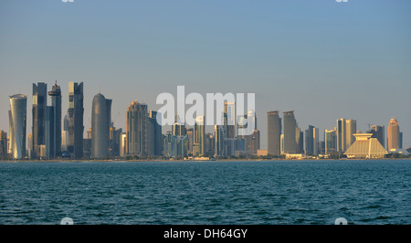 Skyline of Doha in the evening light, Doha Corniche, Doha, Doha, Qatar Stock Photo