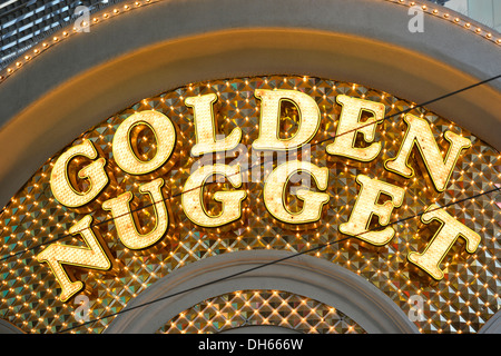 Neon signage of the Golden Nugget Gambling Hotel and Casino, Fremont Street Experience in old Vegas, downtown, Las Vegas, Nevada Stock Photo