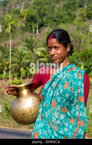 Indian woman wearing a sari, carrying a water jug, Andaman Islands, India Stock Photo