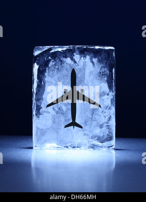 A model airplane frozen in a clear block of ice Stock Photo