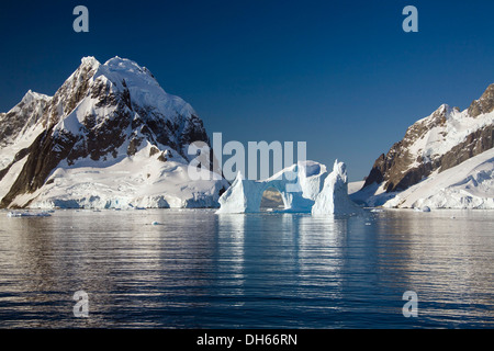 Archway iceberg in Lemaire Channel, Antarctic Peninsula, Antarctica Stock Photo