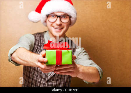 bright picture of handsome man holding gift boxes Stock Photo