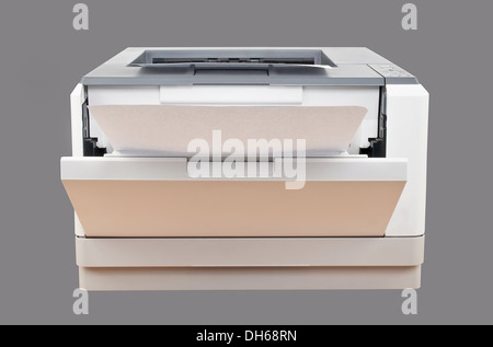 laser printer with paper over gray background Stock Photo