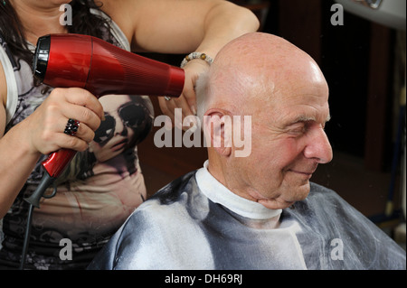 Elderly man at a hairdresser's, having a blow dry, Baden-Wuerttemberg Stock Photo