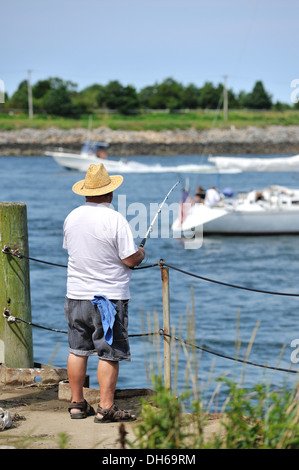 Fisherman fishing at the Cape Cod Canal, Sandwich, MA Stock Photo