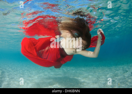 A young woman with big hair posing in Aegean Sea underwater. Greece Stock Photo