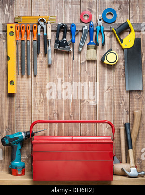 Carpentry tools hanging on the wall. Stock Photo
