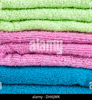 Stack of the multicolored towels Stock Photo