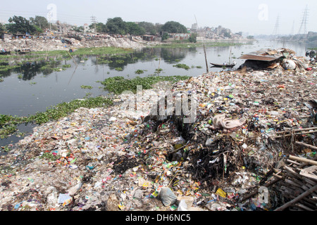 Household waste chokes and pollutes the Buriganga River, the lifeline of the capital, on both banks near chhata masjid in kamara Stock Photo