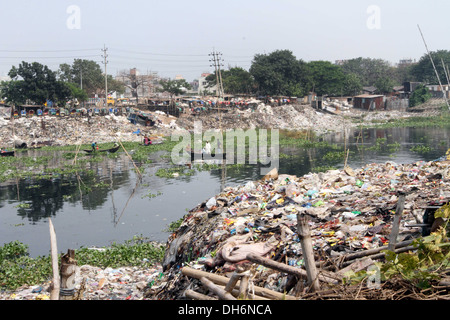 Household waste chokes and pollutes the Buriganga River, the lifeline of the capital, on both banks near chhata masjid in kamara Stock Photo