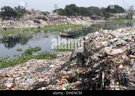 Household waste chokes and pollutes the Buriganga River, the lifeline of the capital, in Dhaka . 2013. Stock Photo