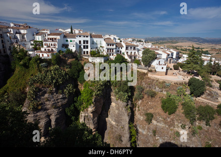 Houses on the edge of the canyon in Ronda, Andalusia, Spain Stock Photo