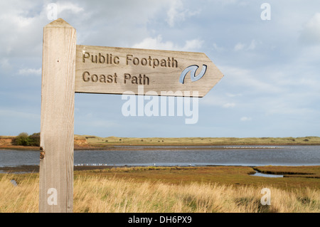 Wooden signpost Public Footpath Coast Path with river Coquet  in background Amble  Northumberland  England UK Stock Photo