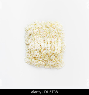 Millet flakes on white background Stock Photo
