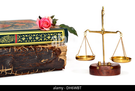 old book, holy quran on rose and justice scales Stock Photo