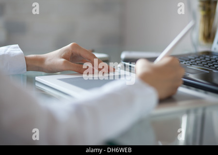 Female designer using graphics pad in office Stock Photo