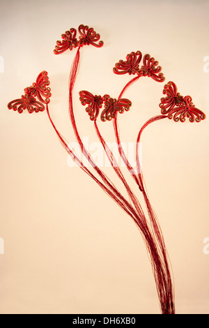 Chinese frog buttons in the shape of Chrysanthemum flowers with red tassels Stock Photo