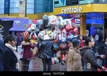 Man selling balloons in the street in Croydon, England. Stock Photo