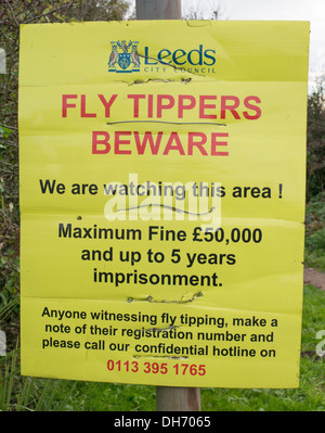 Notice Fly Tippers Beware Leeds City Council, penalty maximum fine £50,000 and up to 5 years imprisonment. Stock Photo