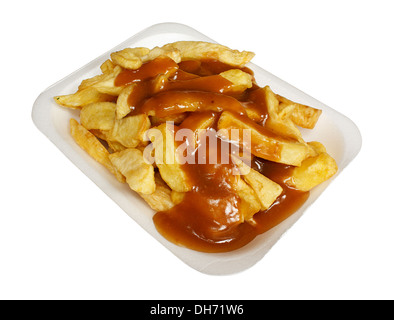 French Fries or Chips and gravy a popular european takeaway snack, served in a polystyrene tray from a take out. Stock Photo