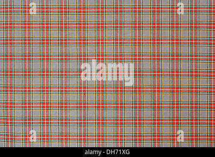 Scottish tartan background a checked plaid weave pattern with red, green and yellow colours. Stock Photo
