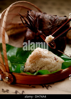 Chinese traditional food Zongzi in a bamboo container Stock Photo