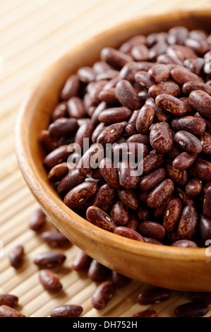 Wooden bowl full of Red speckled kidney beans Stock Photo