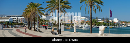Portugal, the Algarve, Portimão palm-lined promenade with modern sculpture structures Stock Photo
