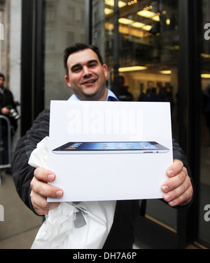 Scott from London is one of first customers to get his hands on new iPad the launch of new 3rd Generation iPad at Apple Store Stock Photo